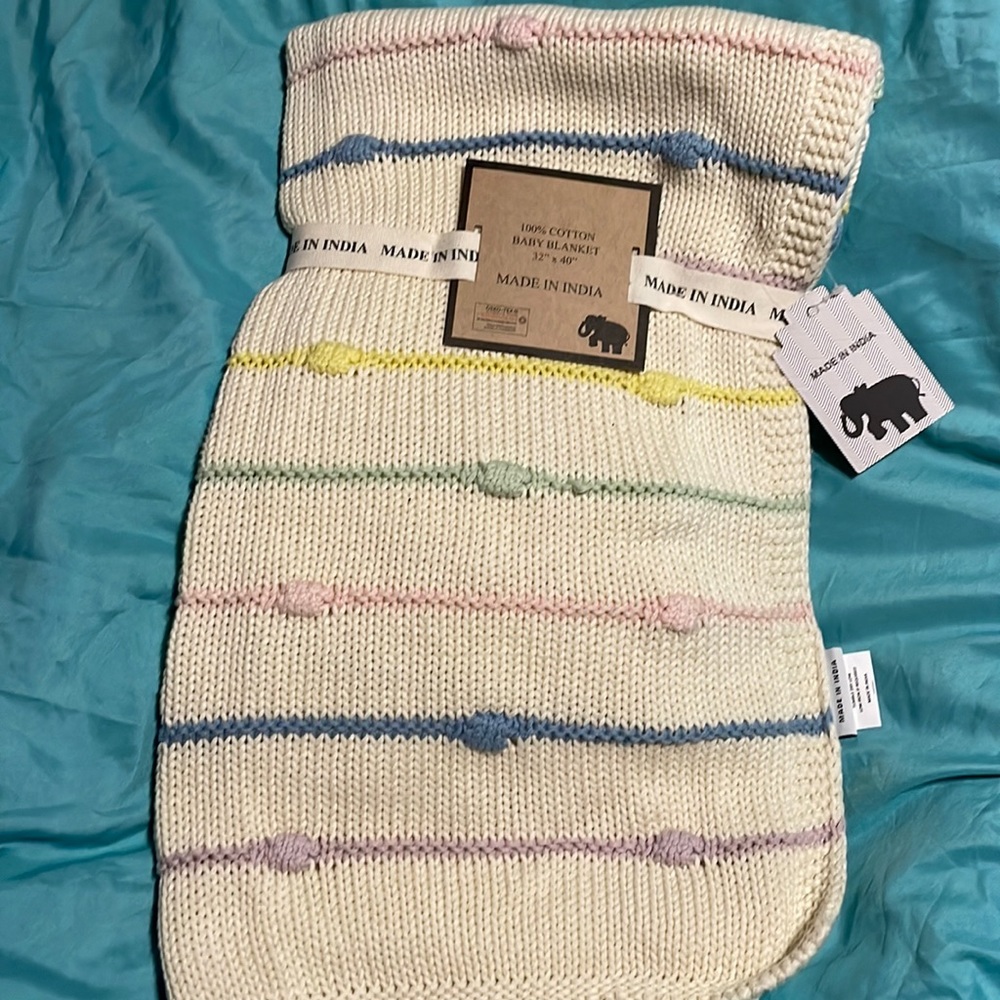Cream stripped knit baby blanket